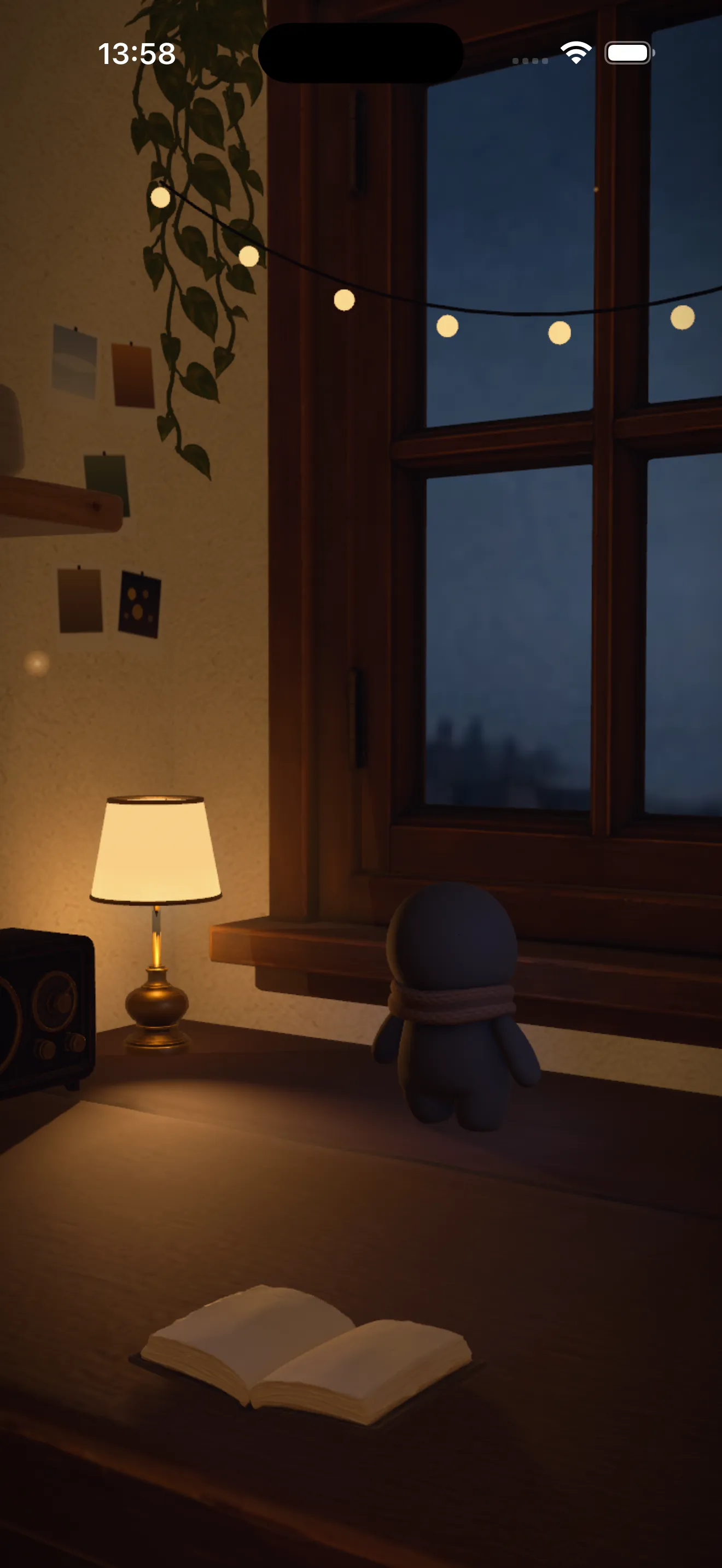 The room at dusk: the resident stands at the window under a string of small bulbs, a lamp lit beside them